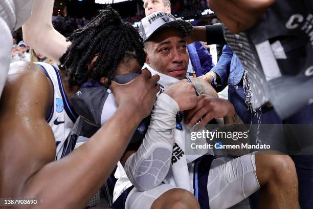 Justin Moore of the Villanova Wildcats reacts after an injury after defeating the Houston Cougars 50-44 in the NCAA Men's Basketball Tournament Elite...