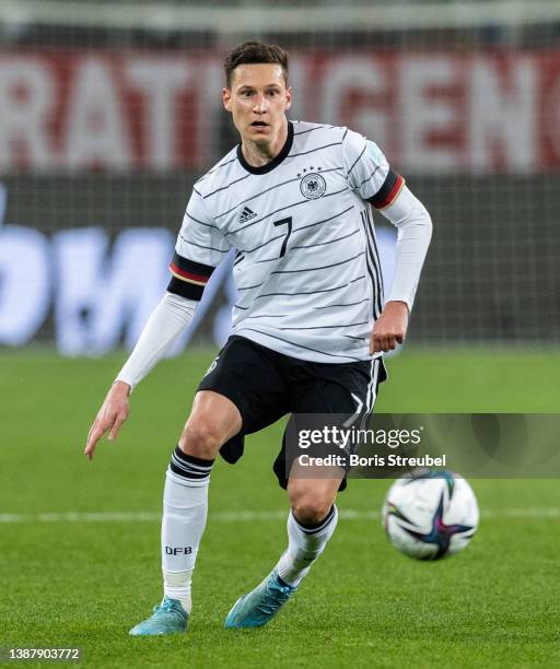 Julian Draxler of Germany runs with the ball during the international friendly match between Germany and Israel at PreZero-Arena on March 26, 2022 in...