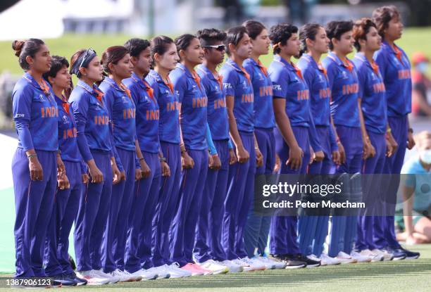 Mithali Raj from India , left, leads her team in the national anthem during the 2022 ICC Women's Cricket World Cup match between India and South...