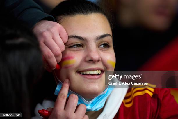 Young Spain fan has her face painted with the colors of the Spanish flag prior to the international friendly match between Spain and Albania at RCDE...