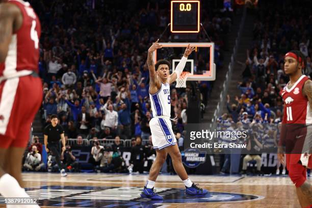 Paolo Banchero of the Duke Blue Devils celebrates after teammate Trevor Keels made a 3-point shot during the first half against the Arkansas...