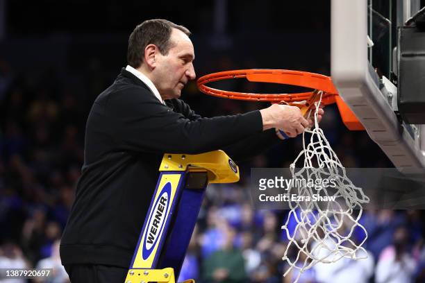 Head coach Mike Krzyzewski of the Duke Blue Devils cuts down the net after defeating the Arkansas Razorbacks 78-69 during the second half in the NCAA...