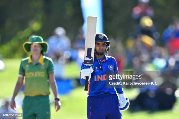 Mithali Raj of India celebrates her half cen during the 2022 ICC Women's Cricket World Cup match between India and South Africa at Hagley Oval on...