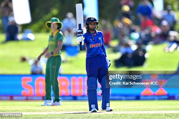 Mithali Raj of India celebrates her half cen during the 2022 ICC Women's Cricket World Cup match between India and South Africa at Hagley Oval on...