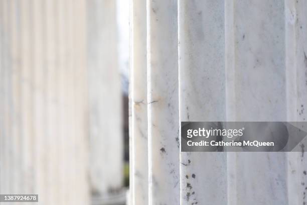 weathered white marble architectural columns in formal garden - frieze stock pictures, royalty-free photos & images