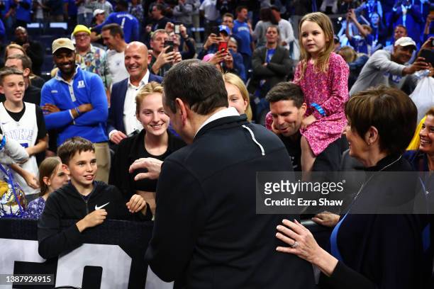 Head coach Mike Krzyzewski of the Duke Blue Devils celebrates with family members after defeating the Arkansas Razorbacks 78-69 in the NCAA Men's...