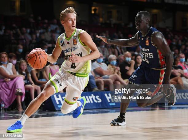 Kyle Adnam of the Phoenix chased by Sunday Dech of the 36ers during the round 17 NBL match between Adelaide 36ers and South East Melbourne Phoenix at...