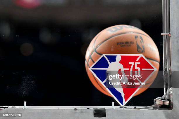 General view of the NBA's 75th anniversary season logo on the backboard before the game between the Portland Trail Blazers and the Houston Rockets at...