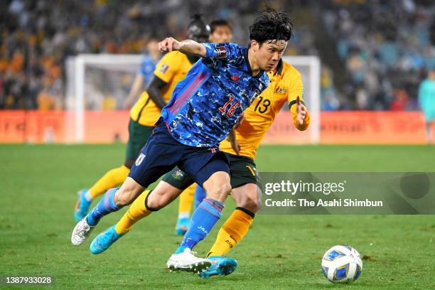 Miki Yamane of Japan controls the ball under pressure of Joel King of Australia during the FIFA World Cup Asian Qualifier Final Round Group B between...