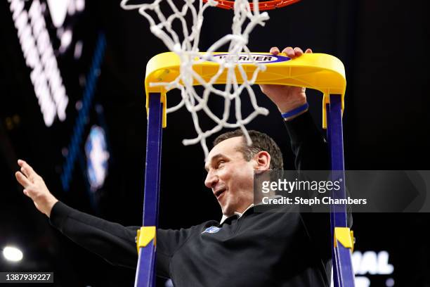 Head coach Mike Krzyzewski of the Duke Blue Devils reacts before cutting down the net after defeating the Arkansas Razorbacks 78-69 during the second...