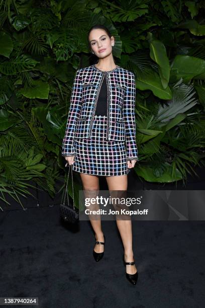 Lily James attends the CHANEL and Charles Finch Pre-Oscar Awards Dinner at the Polo Lounge on March 26, 2022 in Beverly Hills, California.