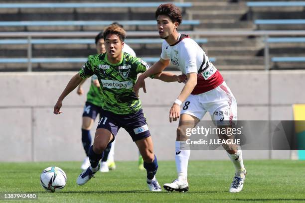 Yu Okubo of Gainare Tottori and Hayato Teruyama of FC Imabari compete for the ball during the J.LEAGUE Meiji Yasuda J3 3rd Sec. Match between Gainare...