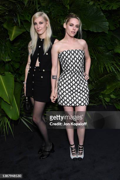 Dylan Meyer and Kristen Stewart attend the CHANEL and Charles Finch Pre-Oscar Awards Dinner at the Polo Lounge on March 26, 2022 in Beverly Hills,...