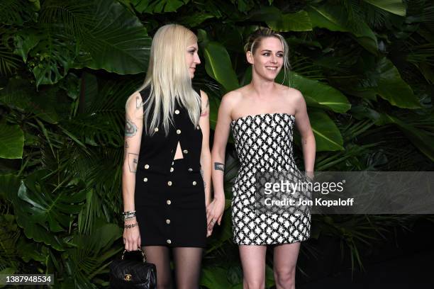 Dylan Meyer and Kristen Stewart attend the CHANEL and Charles Finch Pre-Oscar Awards Dinner at the Polo Lounge on March 26, 2022 in Beverly Hills,...