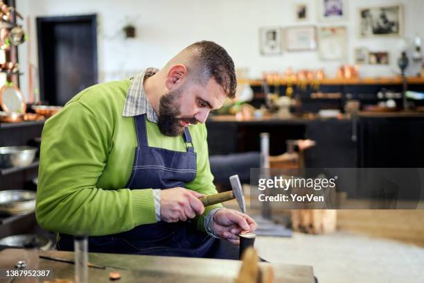jewelry designer working in his workshop - jewelry shop stock pictures, royalty-free photos & images
