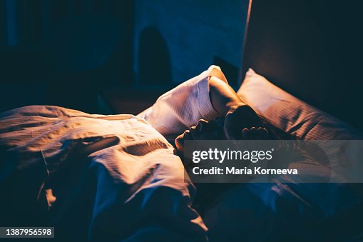Woman with Insomnia. Young woman lying on bed with hand on forehead. Woman with Insomnia. Young woman lying on bed with hand on forehead.