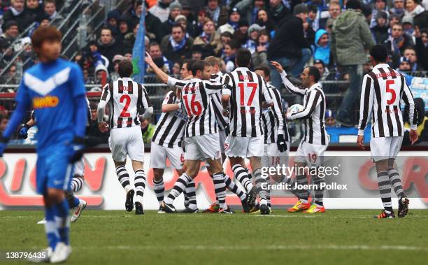 Sebastian Schachten of St. Pauli celebrates with his team mates after scoring his team's first goal during the Second Bundesliga match between FC St....