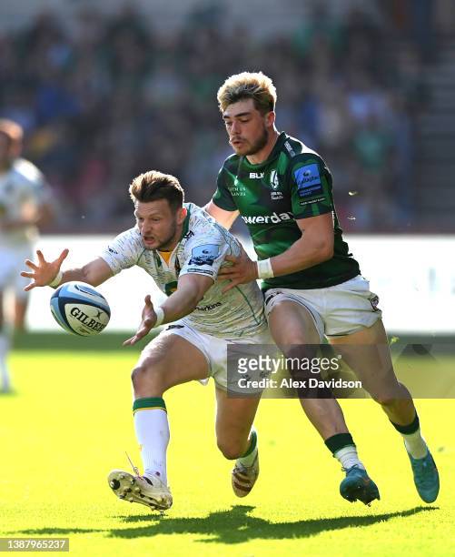 Dan Biggar of Northampton Saints and Ollie Hassell-Collins of London Irish compete for the ball during the Gallagher Premiership Rugby match between...