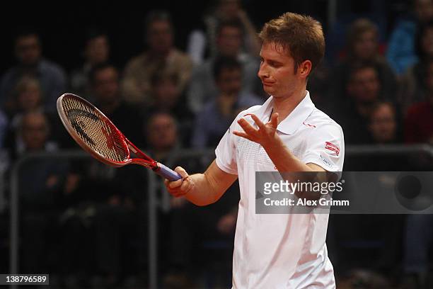 Florian Mayer of Germany reacts during his match against Juan Ignacio Chela of Argentina on day 3 of the Davis Cup World Group first round match...