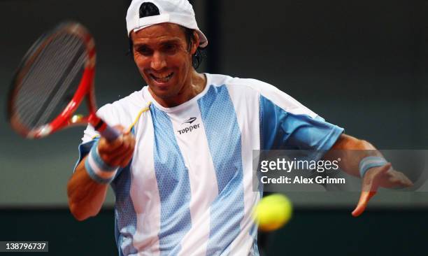 Juan Ignacio Chela of Argentina returns the ball to Florian Mayer of Germany during the Davis Cup World Group first round match between Germany and...