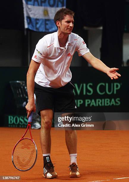 Florian Mayer of Germany reacts during his match against Juan Ignacio Chela of Argentina on day 3 of the Davis Cup World Group first round match...