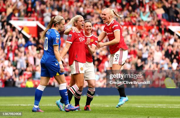 Alessia Russo of Manchester United celebrates with Jade Moore and Maria Thorisdottir after scoring their team's third goal during the Barclays FA...