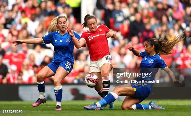 Kirsty Hanson of Manchester United battles for possession with Gabrielle George and Poppy Pattinson of Everton during the Barclays FA Women's Super...