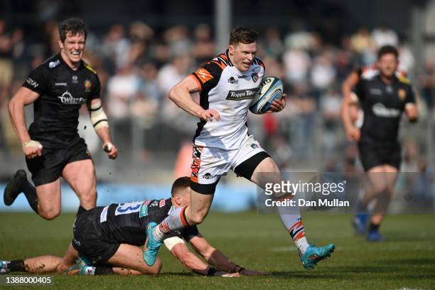 Chris Ashton of Tigers makes a break past Henry Slade of Chiefs to score the third try during the Gallagher Premiership Rugby match between Exeter...