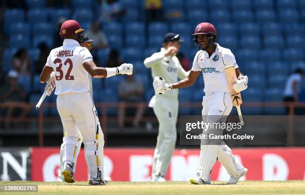 West Indies captain Kraigg Brathwaite celebrates with John Campbell after winning the 3rd Test match between the West Indies and England at National...