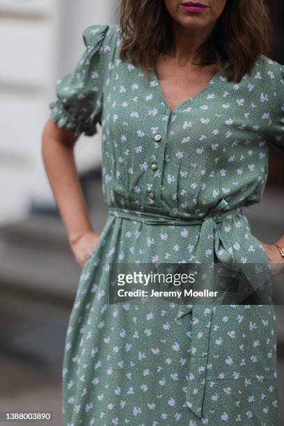 Anna Wolfers wearing a green and floral midi dress via goldigshop.de on March 25, 2022 in Hamburg, Germany.