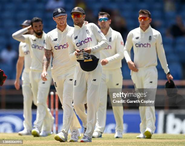 England captain Joe Root is consoled by Ben Stokes after losing the 3rd Test match between the West Indies and England at National Cricket Stadium on...