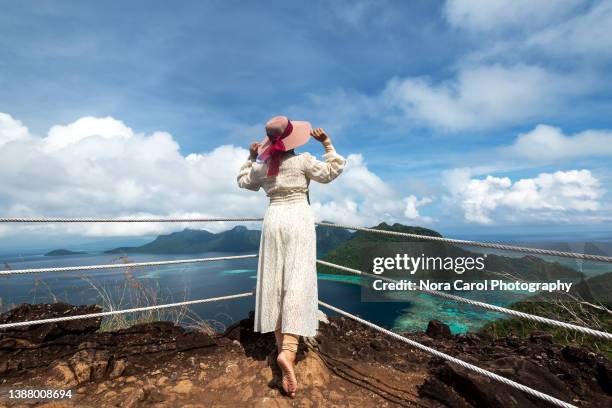 women looking at beautiful view bohey dulang - ostmalaysia stock-fotos und bilder