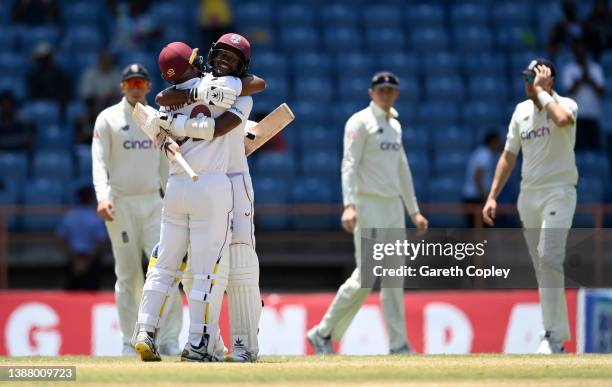 West Indies captain Kraigg Brathwaite celebrates with John Campbell after winning the 3rd Test match between the West Indies and England at National...