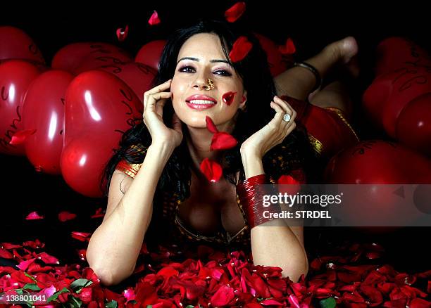 Bollywood actress and model Rozlyn Khan poses for a Valentine’s Day photo shoot in Mumbai on February 12, 2012. AFP PHOTO/STR