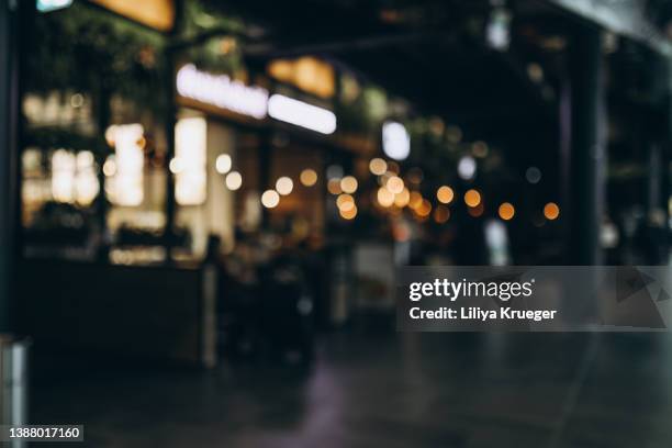 defocused image of city street. - blurred motion restaurant stock pictures, royalty-free photos & images