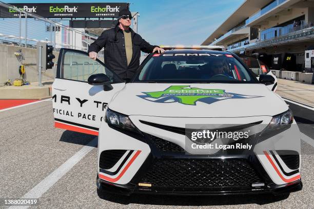 Professional wrestler The Undertaker posse for a photo prior to his pace car practice ride for the NASCAR Cup Series Echopark Automotive Grand Prix...