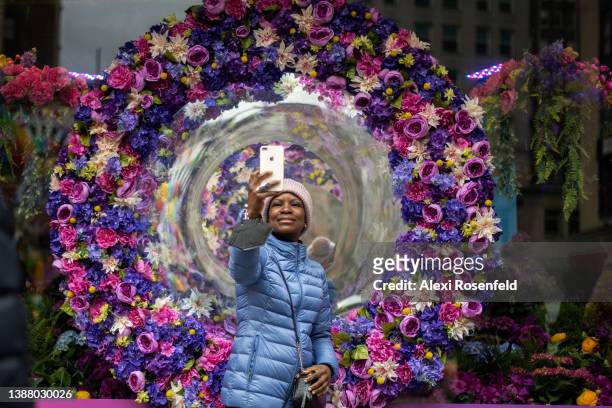 Woman takes a selfie at the 2022 Macy's Flower Show at Macy's Herald Square on March 27, 2022 in New York City. This year's theme is about the...