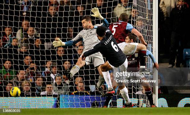 Joleon Lescott of Manchester City scores the opening goal past Shay Given of Aston Villa during the Barclays Premier League match between Aston Villa...