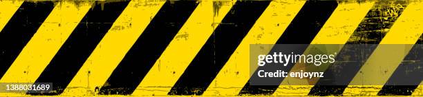 danger! seamless yellow and black grunge warning lines - cordon tape stock illustrations