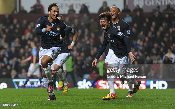 Joleon Lescott of Man City celebrates scoring to make it 1-0 with David Silva and Vincent Kompany during the Barclays Premier league match between...