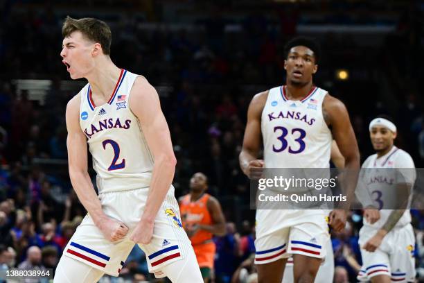 Christian Braun of the Kansas Jayhawks celebrates after a three-point basket against the Miami Hurricanes during the second half in the Elite Eight...