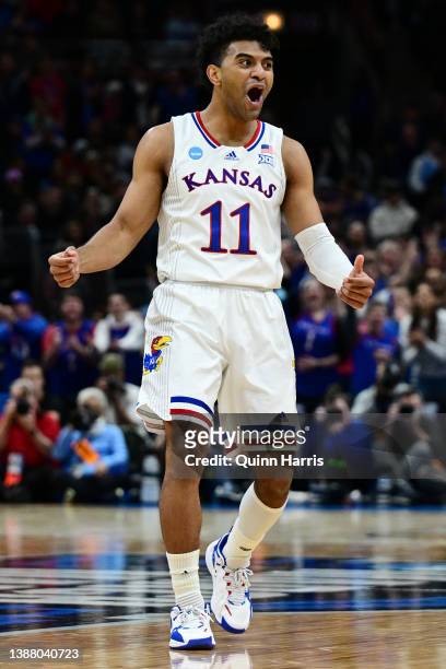 Remy Martin of the Kansas Jayhawks celebrates after scoring a three-point basket against the Miami Hurricanes during the second half in the Elite...