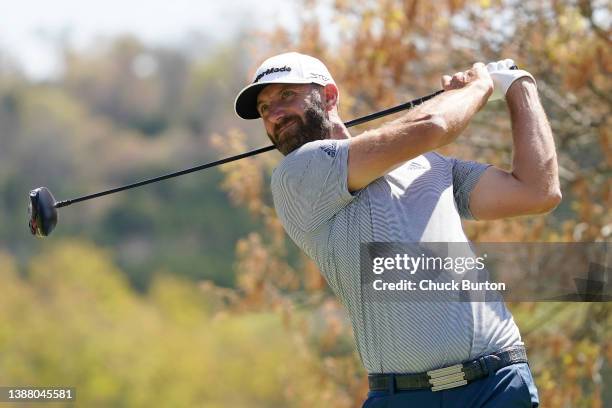 Dustin Johnson of the United States plays his shot from the sixth tee in his third place match against Corey Conners of Canada on the final day of...