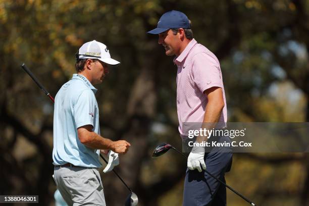 Kevin Kisner of the United States and Scottie Scheffler of the United States look on from the eighth tee in their finals match on the final day of...