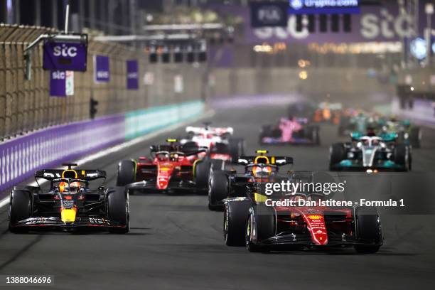 Charles Leclerc of Monaco driving the Ferrari F1-75 leads Max Verstappen of the Netherlands driving the Oracle Red Bull Racing RB18 during the F1...