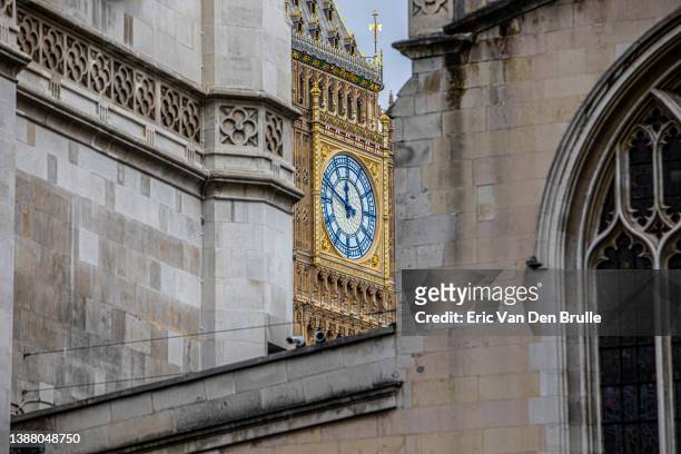 big ben in the distance of westminster abbey - eric van den brulle stock pictures, royalty-free photos & images