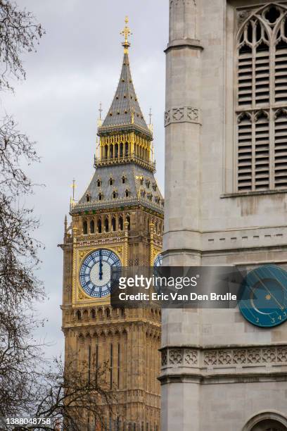 big ben behind westminster abbey - eric van den brulle stock pictures, royalty-free photos & images