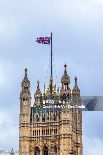 victoria tower detail with british flag - eric van den brulle stock pictures, royalty-free photos & images