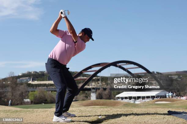 Scottie Scheffler of the United States plays a shot on the 12th hole in his finals match against Kevin Kisner of the United States on the final day...