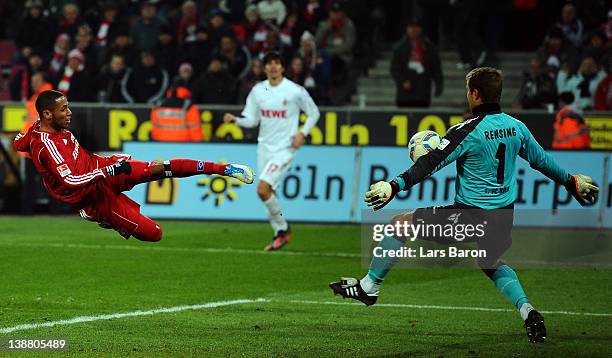 Goalkeeper Michael Rensing of Koeln saves a shoot of Dennis Aogo of Hamburg during the Bundesliga match between 1. FC Koeln and Hamburger SV at...